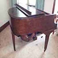 Reliable Piano Removalists Moving a baby grand piano