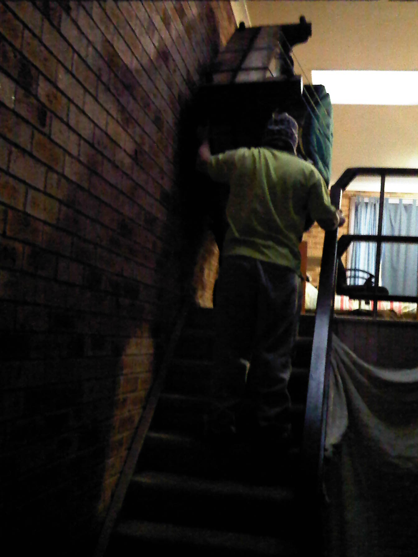 moving a piano down stairs